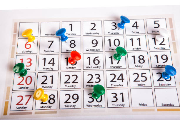 Calendar with red push pin